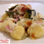 Potatoes dumplings gratinated with cheese