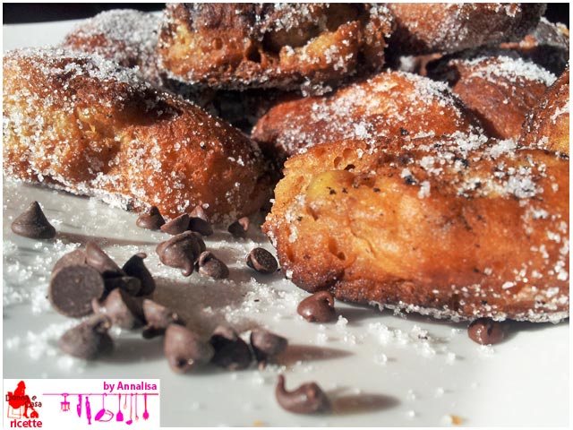 Friedcakes with chocolate drops close